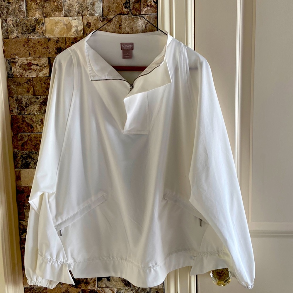 Chico, white wind breaker, size 1, zipper pockets, adjustable pull.  Never worn